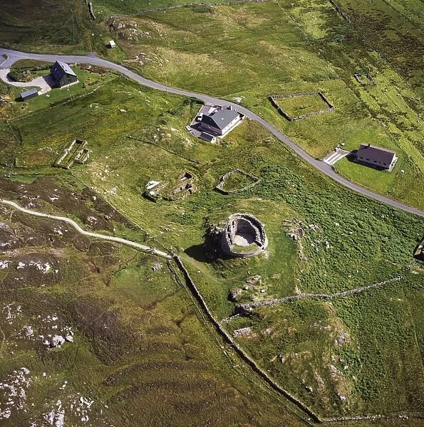 Aerial image of Scotland, UK: Dun Carloway, Carloway, on the west coast of the Isle of Lewis, Outer Hebrides: a remarkably well preserved Iron Age Broch, with part of the wall still stands to a height of 9 metres