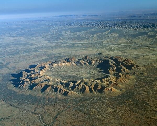 Australia A meteorite crater 130 million years old. Inner crater is 4km wide ramparts are 250 metres high. Rising above Missionary Plain Gosse Bluff, Northern Territory