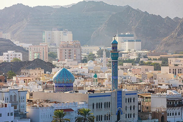 Middle East, Arabian Peninsula, Oman, Muscat, Muttrah. Blue minaret and dome of a mosque in Muttrah. Date: 20-10-2019