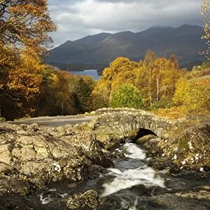 Ashness Bridge in autumn looking towards Derwent Water and the mountains of Skiddaw - Lake District - England