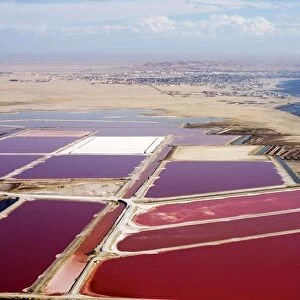 Evaporation ponds for the commercial extraction of sea salt - showing the bright resulting colours - Near Swakopmund - Namib Deser - Atlantic Coast - Namibia - Africa