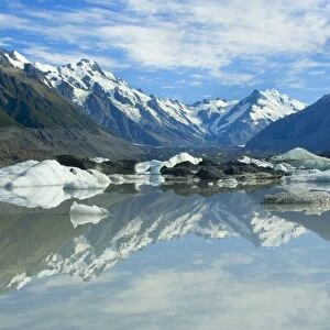 Mount Cook Scenery stunning mountains and Tasman Glacier reflected in Tasman Glacier Lake covered by small icebergs Tasman Valley, Mount Cook National Park, Canterbury, South Island, New Zealand