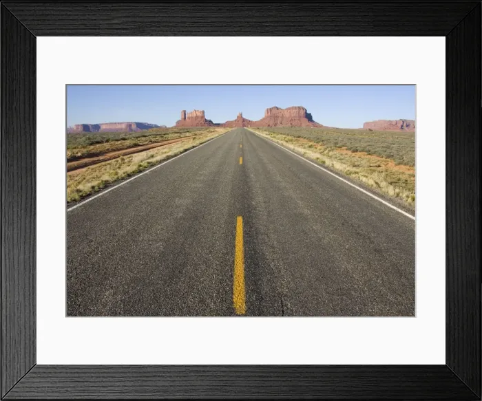 Framed Print : USA - One of the most famous images of the Monument Valley is the long straight road (US 163) leading across flat desert towards sandstone buttes and pinnacles of rock. Monument Valley Tribal Park, Navajo Nation, Arizona / Utah, USA Framed Print : USA - One of the most famous images of the Monument Valley is the long straight road (US 163) leading across flat desert towards sandstone buttes and pinnacles of rock. Monument Valley Tribal Park, Navajo Nation, Arizona / Utah, USA