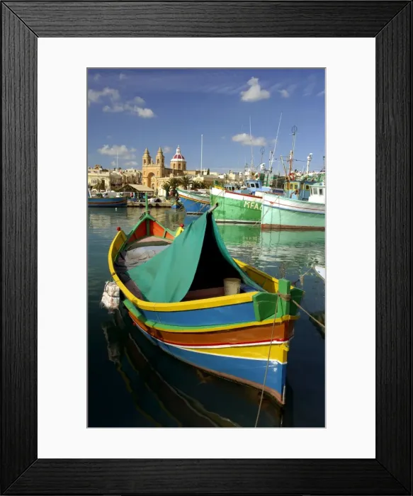 Framed Print : Malta - Marsaxlokk Bay is charming, and the most important fishing port on. The multi-coloured fishing boats are traditional Maltese and are called Luzzu The Bay is vulnerable Framed Print : Malta - Marsaxlokk Bay is charming, and the most important fishing port on. The multi-coloured fishing boats are traditional Maltese and are called Luzzu The Bay is vulnerable