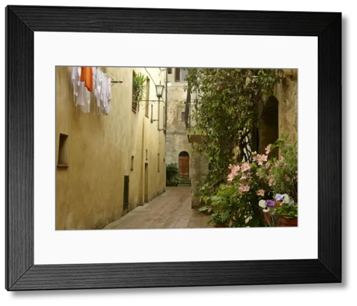 Framed Print : Street scene in Pienza historic building in the city centre of Pienza Val d Orcia, Tuscany, Italy