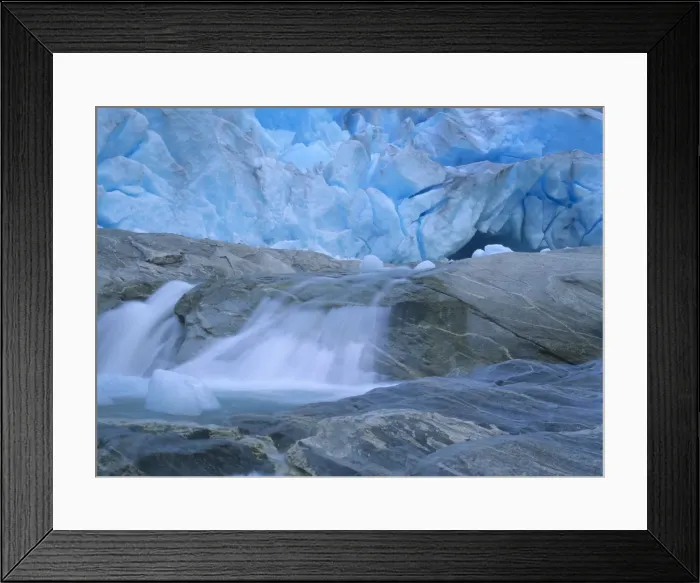 Framed Print : Glacier opening blue glacier ice and glacial river at Nigardsbreen glacier Jostedalsbreen National Park, Norway Framed Print : Glacier opening blue glacier ice and glacial river at Nigardsbreen glacier Jostedalsbreen National Park, Norway