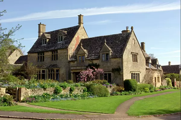 England - A typical Cotswold cottage on a Spring day in April. Cotswolds, UK