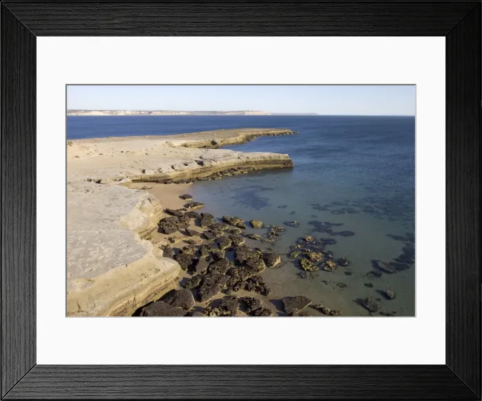 Framed Print : Argentina - Valdes Peninsula, Province Chubut. Low tide in Golfo Nuevo, at Punta Pardela, near Puerto Piramide. Exposed horizontal rock layers are the 20 Million year old marine Patagonia formation