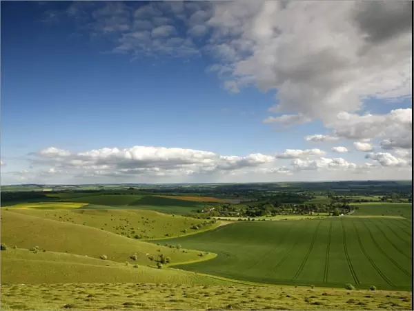 The Vale of Pewsey seen from Walkers Hill, which is part of the Pewsey Downs Nature Reserve near Alton Barnes, Wiltshire, England. Fingers of chalk downland spread out into rich arable land below