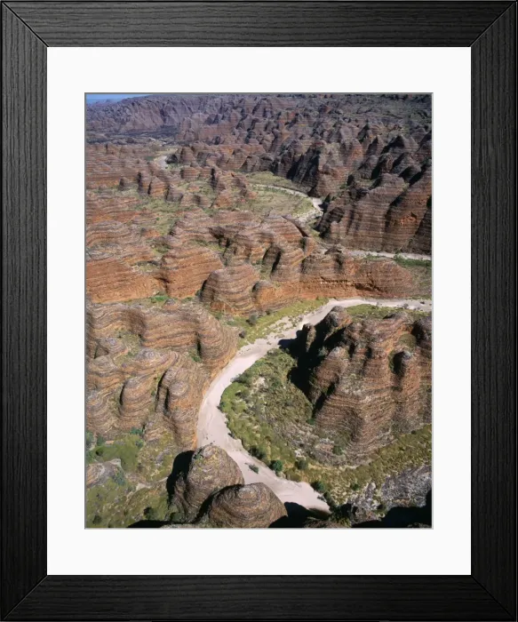 Framed Print : Western Australia - sandstone range formed 400 million years ago. Layered sediements washed into a rift valley, eroded into beehive formations & deep canyon-type valleys. Purnululu National Park, Bungle-bungle Range Framed Print : Western Australia - sandstone range formed 400 million years ago. Layered sediements washed into a rift valley, eroded into beehive formations & deep canyon-type valleys. Purnululu National Park, Bungle-bungle Range