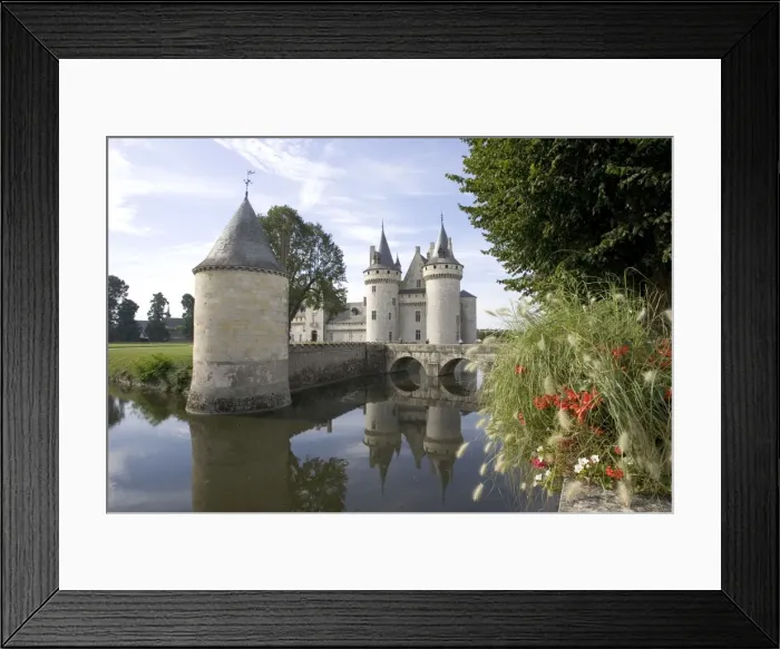 Framed Print : Chateau of Sully-sur-Loire, France - Towers of the classic medieval fortress of Chateau of Sully-sur-Loire. Built in the 14th century it is approached over a moat by a wooden walkway and drawbridge, France Framed Print : Chateau of Sully-sur-Loire, France - Towers of the classic medieval fortress of Chateau of Sully-sur-Loire. Built in the 14th century it is approached over a moat by a wooden walkway and drawbridge, France