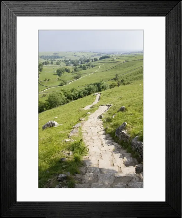 Framed Print : Malham Cove is a famous outcrop of curved limestone cliffs in Yorkshire Dales, UK. Over 250 ft high this was once the location of a spectacular waterfall though today there is only a small beck or tarn flowing from the base Framed Print : Malham Cove is a famous outcrop of curved limestone cliffs in Yorkshire Dales, UK. Over 250 ft high this was once the location of a spectacular waterfall though today there is only a small beck or tarn flowing from the base