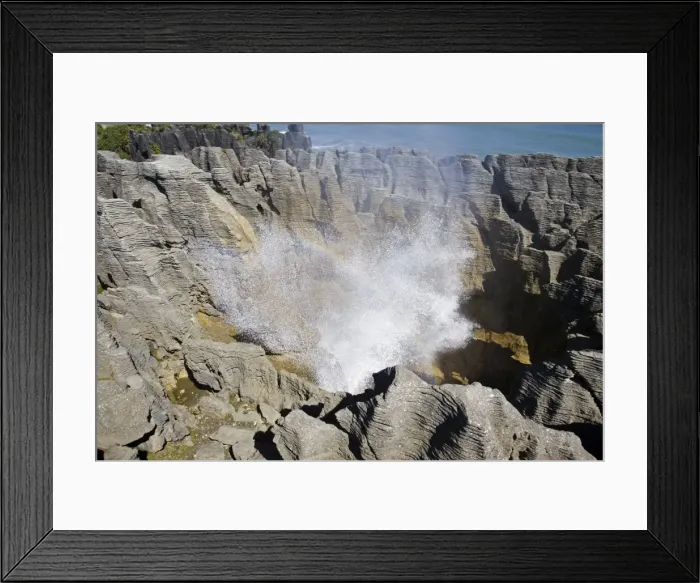 Framed Print : Limestone outcrops on cliffs. Punakaiki - South Island - New Zealand. Pancake rocks form the main focus for visitors in Paparoa National Park where huge outcrops of limestone have been formed by a process called stylobedding Framed Print : Limestone outcrops on cliffs. Punakaiki - South Island - New Zealand. Pancake rocks form the main focus for visitors in Paparoa National Park where huge outcrops of limestone have been formed by a process called stylobedding