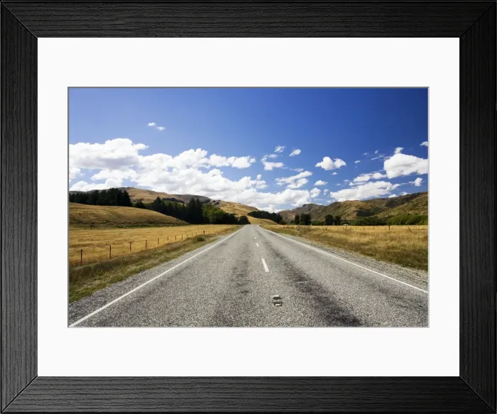 Framed Print : Road - long straight deserted tarmac paved road, rolling hills, white clouds, blue sky. Mackenzie country - New Zealand Framed Print : Road - long straight deserted tarmac paved road, rolling hills, white clouds, blue sky. Mackenzie country - New Zealand