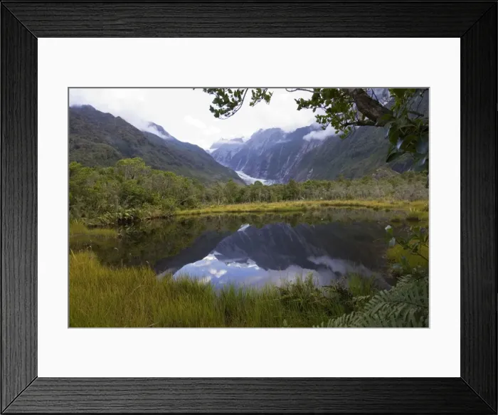 Framed Print : New Zealand - Franz Josef glacier reflected in Peter's Pool. Westland National Park - South Island - New Zealand Framed Print : New Zealand - Franz Josef glacier reflected in Peter's Pool. Westland National Park - South Island - New Zealand
