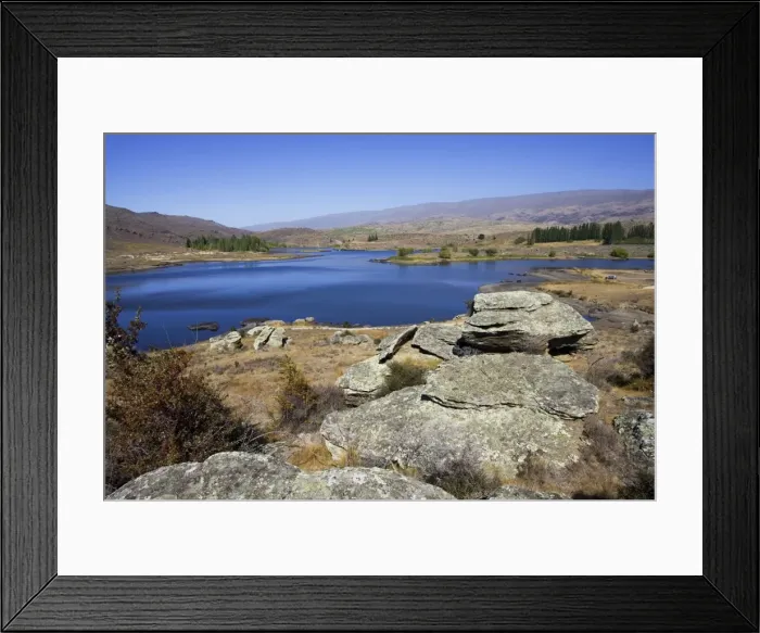 Framed Print : New Zealand - Schist rock outcrops in Flat Top Conservation Area near Alexanda New Zealand. The Dam and its outlet tunnel (728 metres through solid schist rock)