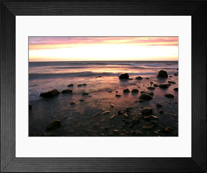 Framed Print : Sunrise at sea beach with boulders and approaching waves Moen Peninsula, Denmark Framed Print : Sunrise at sea beach with boulders and approaching waves Moen Peninsula, Denmark