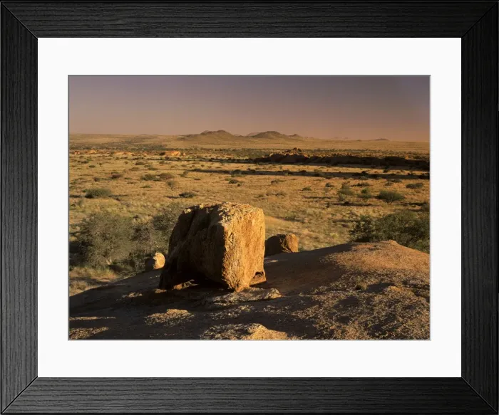 Framed Print : Boulder and savanna in late evening light at the Pandok mountain area Pandok mountains, Namibia Framed Print : Boulder and savanna in late evening light at the Pandok mountain area Pandok mountains, Namibia