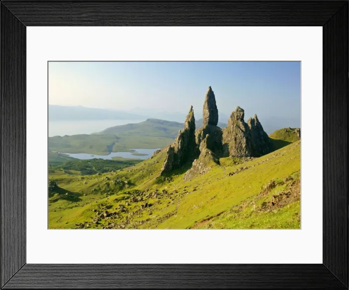 Framed Print : Mountain scenery rolling green slopes and bizarre rock formation Old Man of Storr seen from above with view towards Sound of Raasay Isle of Skye, Western Highlands, Scotland, UK Framed Print : Mountain scenery rolling green slopes and bizarre rock formation Old Man of Storr seen from above with view towards Sound of Raasay Isle of Skye, Western Highlands, Scotland, UK