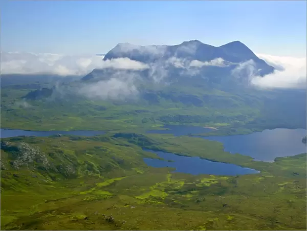 Inverpolly Nature Reserve view from Stac Pollaidh over Loch Sionascaig to Suilven with it's summit enveloped in dispersing clouds Inverpolly Nature Reserve, Wester Ross, Highlands, Scotland, UK