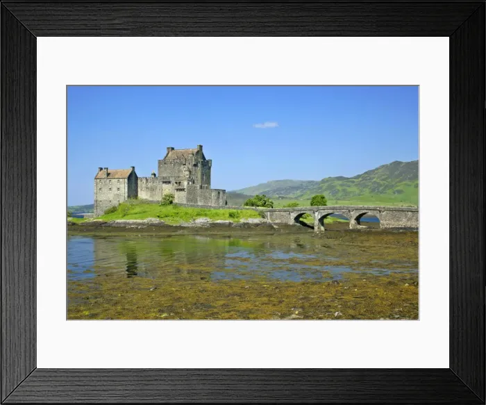 Framed Print : Eilean Donan Castle view of castle located in Loch Duich at low tide on a sunny day Kyle of Lochalsh, Highlands, Scotland, UK Framed Print : Eilean Donan Castle view of castle located in Loch Duich at low tide on a sunny day Kyle of Lochalsh, Highlands, Scotland, UK