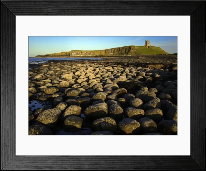 Framed Print : Dunstanburgh Castle-view from the north of castle on whin Sill, from basalt boulder strewn beach, Northumberland UK Framed Print : Dunstanburgh Castle-view from the north of castle on whin Sill, from basalt boulder strewn beach, Northumberland UK