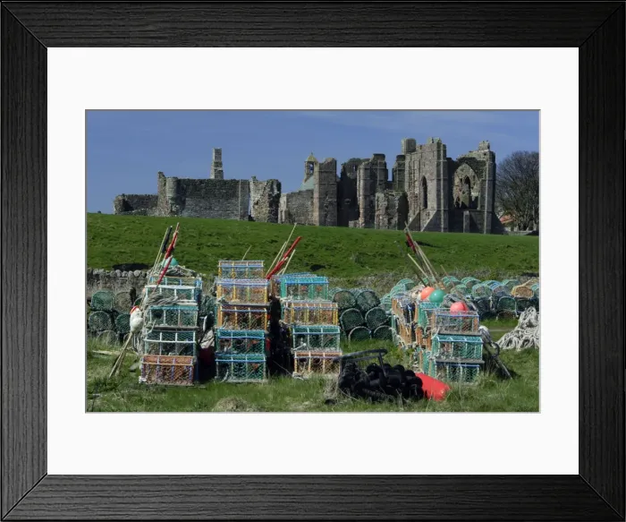 Framed Print : Lindisfarne, Holy Island-Lobster pots in front of monasty ruins, Northumberland UK Framed Print : Lindisfarne, Holy Island-Lobster pots in front of monasty ruins, Northumberland UK