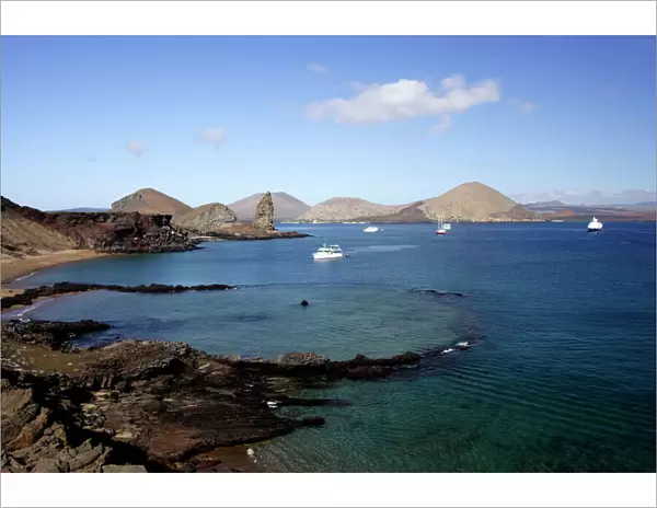 View of coastline and incoming boats from Bartolome Island, Galapagos Islands