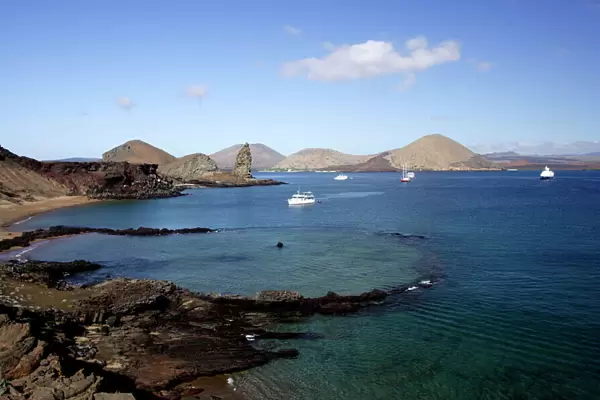 View of coastline and incoming boats from Bartolome Island, Galapagos Islands