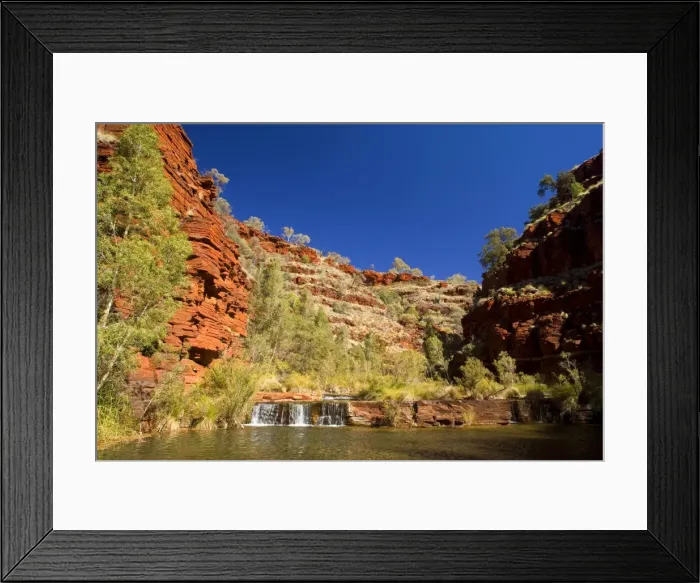 Framed Print : Dales Gorge - stream flows down Dales Gorge over a number of picturesque cascades into pools, surrounded by gum trees and vegetation. Red, terraced cliffs weathered by centuries of exposure, rise up to the river's sides - Dales Gorge Framed Print : Dales Gorge - stream flows down Dales Gorge over a number of picturesque cascades into pools, surrounded by gum trees and vegetation. Red, terraced cliffs weathered by centuries of exposure, rise up to the river's sides - Dales Gorge