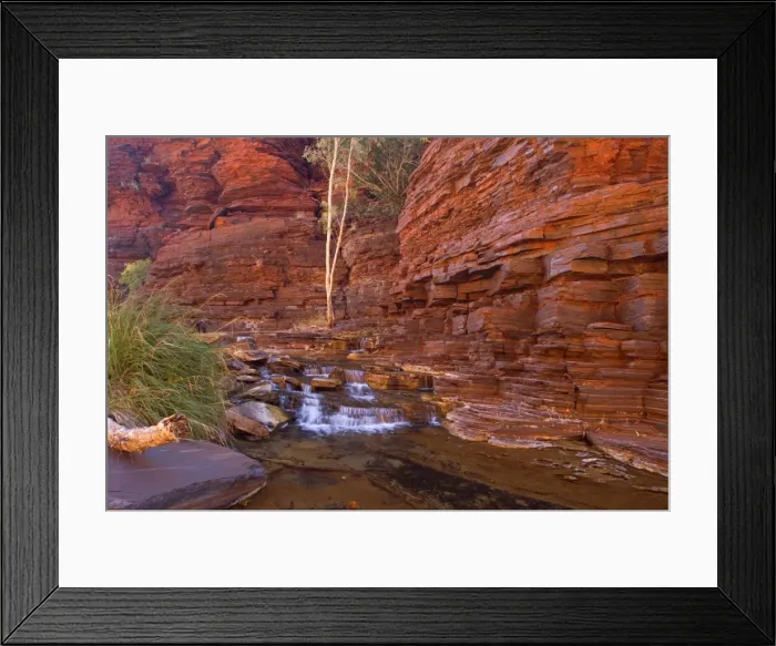 Framed Print : Cascades in Kalamina Gorge - picturesque cascades in Kalamina Gorge, surrounded by steep, terraced red walls. The cascade is in the shade but the reflecting walls cast a warm light upon the whole scenery - Kalamina Gorge, Hamersley Range Framed Print : Cascades in Kalamina Gorge - picturesque cascades in Kalamina Gorge, surrounded by steep, terraced red walls. The cascade is in the shade but the reflecting walls cast a warm light upon the whole scenery - Kalamina Gorge, Hamersley Range