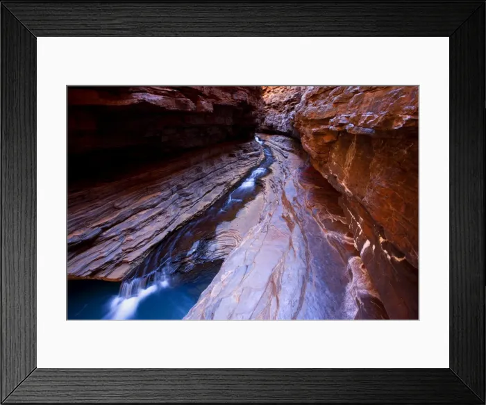 Framed Print : Kermit's Pool - a stream is flowing down Hancock Gorge, surrounded by steep, red and very terraced ciffs, into Kermit's Pool. Because of it's depth the pool's water appears an amazing deep blue Framed Print : Kermit's Pool - a stream is flowing down Hancock Gorge, surrounded by steep, red and very terraced ciffs, into Kermit's Pool. Because of it's depth the pool's water appears an amazing deep blue