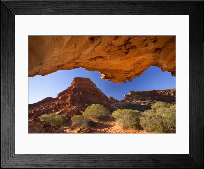 Framed Print : Mushroom Rock view from sandstone rock formation called the mushroom onto the colourful cliffs of Rainbow Valley. The sun reflects on the rocks and casts a red light onto the foreground - Rainbow Valley, Simpson Desert area Framed Print : Mushroom Rock view from sandstone rock formation called the mushroom onto the colourful cliffs of Rainbow Valley. The sun reflects on the rocks and casts a red light onto the foreground - Rainbow Valley, Simpson Desert area