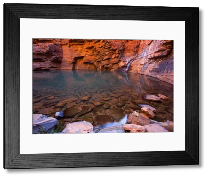 Framed Print : Handrail Pool - a waterfall flows into a hugh pool hidden within the steep, red and very terraced walls of Weano Gorge. The waterfall and walls are reflecting in the calm surface of the clear and very cold water - Weano Gorge, Hamersley Range Framed Print : Handrail Pool - a waterfall flows into a hugh pool hidden within the steep, red and very terraced walls of Weano Gorge. The waterfall and walls are reflecting in the calm surface of the clear and very cold water - Weano Gorge, Hamersley Range