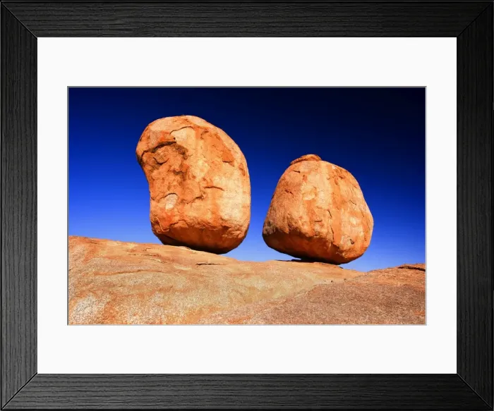 Framed Print : Devils Marbles - two nearly perfectly circular shaped boulder of red granite balanced on bedrock - Devils Marbles Conservation Area, Northern Territory, Australia Framed Print : Devils Marbles - two nearly perfectly circular shaped boulder of red granite balanced on bedrock - Devils Marbles Conservation Area, Northern Territory, Australia