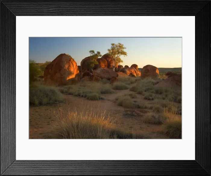 Framed Print : Devils Marbles - several circular shaped marbles of red granite situated amidst grassy bushland in last evening light - Devils Marbles Conservation Area, Northern Territory, Australia Framed Print : Devils Marbles - several circular shaped marbles of red granite situated amidst grassy bushland in last evening light - Devils Marbles Conservation Area, Northern Territory, Australia