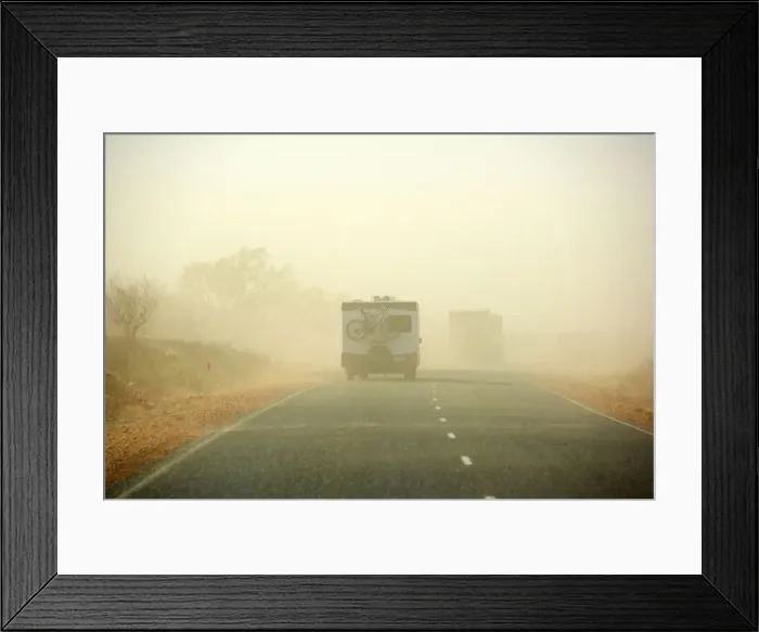 Framed Print : Sandstorm - a hugh sandstorm sweeps over a road in the outback. Cars are almost invisible because of the dense sand clouds - Northern Territory, Australia Framed Print : Sandstorm - a hugh sandstorm sweeps over a road in the outback. Cars are almost invisible because of the dense sand clouds - Northern Territory, Australia