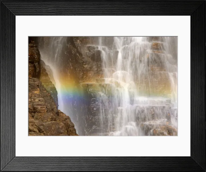 Framed Print : waterfall and rainbow - water cascading down a cliff with a rainbow forming in the water's spray. In the dry season this waterfall will soon be reduced to only a small trickle - Northern Territory, Australia Framed Print : waterfall and rainbow - water cascading down a cliff with a rainbow forming in the water's spray. In the dry season this waterfall will soon be reduced to only a small trickle - Northern Territory, Australia