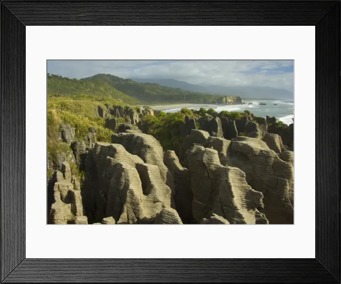 Framed Print : Pancake Rocks famous flat limestone rock formations at Punakaiki with rainforest-clad coastline Paparoa National Park, West Coast, South Island, New Zealand Framed Print : Pancake Rocks famous flat limestone rock formations at Punakaiki with rainforest-clad coastline Paparoa National Park, West Coast, South Island, New Zealand