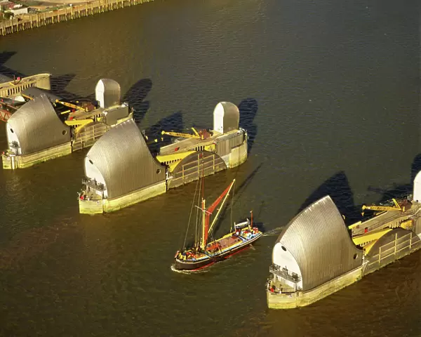 England - Aerial view, Thames barrier and Thames Barge, London UK DW0631