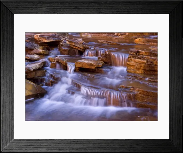 Framed Print : Cascades in Kalamina Gorge - picturesque cascades in Kalamina Gorge, surrounded by steep, terraced red walls. The cascade is in the shade but the reflecting walls cast a warm light upon the whole scenery - Kalamina Gorge, Hamersley Range Framed Print : Cascades in Kalamina Gorge - picturesque cascades in Kalamina Gorge, surrounded by steep, terraced red walls. The cascade is in the shade but the reflecting walls cast a warm light upon the whole scenery - Kalamina Gorge, Hamersley Range