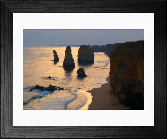 Framed Print : Twelve Apostles sunset - setting sun over the sandstone rock formations of famous Twelve Apostels, which are sculpted by the relentless sea. The force of the sea eats more and more of the rocks away and finally forces them to collapse Framed Print : Twelve Apostles sunset - setting sun over the sandstone rock formations of famous Twelve Apostels, which are sculpted by the relentless sea. The force of the sea eats more and more of the rocks away and finally forces them to collapse