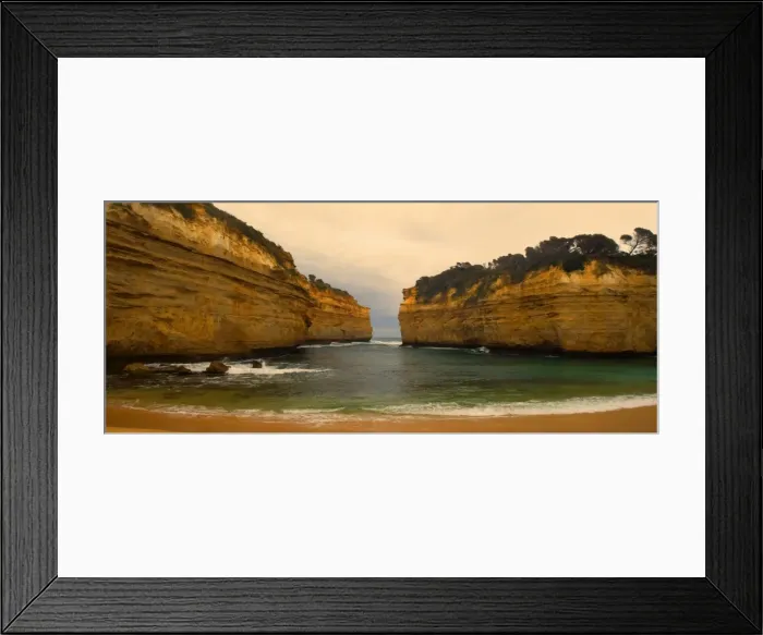 Framed Print : Loch Ard Gorge - view of sandstone cliffs at Loch Ard Gorge from beach. The force of the sea eats more and more of the rocks away and finally forces them to collapse - Port Campbell National Park, Great Ocean Road, Victoria, Australia Framed Print : Loch Ard Gorge - view of sandstone cliffs at Loch Ard Gorge from beach. The force of the sea eats more and more of the rocks away and finally forces them to collapse - Port Campbell National Park, Great Ocean Road, Victoria, Australia