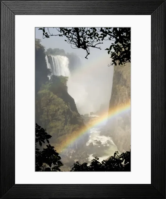Framed Print : Zimbabwe - View of the Zambezi River and the Victoria Falls (all together 1700m wide). The image show the Main Falls (93m high). Early August during the dry season. World Heritage Site. Victoria Falls National Park, Zimbabwe Framed Print : Zimbabwe - View of the Zambezi River and the Victoria Falls (all together 1700m wide). The image show the Main Falls (93m high). Early August during the dry season. World Heritage Site. Victoria Falls National Park, Zimbabwe