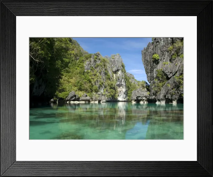 Framed Print : The exit (between the rocks) of a Big Lagoon of El Nido Minilok island, corals are visible in clear waters. Near El Nido Minilok resort, El Nido, Palawan, Philippines. February. Ph41. 0928 Framed Print : The exit (between the rocks) of a Big Lagoon of El Nido Minilok island, corals are visible in clear waters. Near El Nido Minilok resort, El Nido, Palawan, Philippines. February. Ph41. 0928