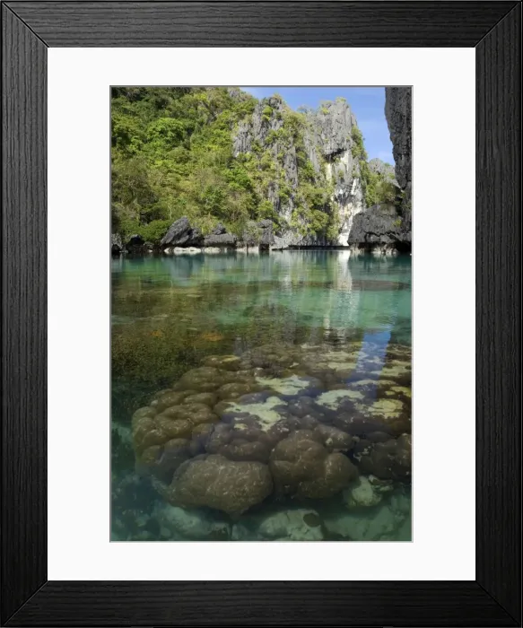 Framed Print : The exit (between the rocks) of a Big Lagoon of El Nido Minilok island, corals are visible in clear waters. Near El Nido Minilok resort, El Nido, Palawan, Philippines. February. Ph41. 0933 Framed Print : The exit (between the rocks) of a Big Lagoon of El Nido Minilok island, corals are visible in clear waters. Near El Nido Minilok resort, El Nido, Palawan, Philippines. February. Ph41. 0933