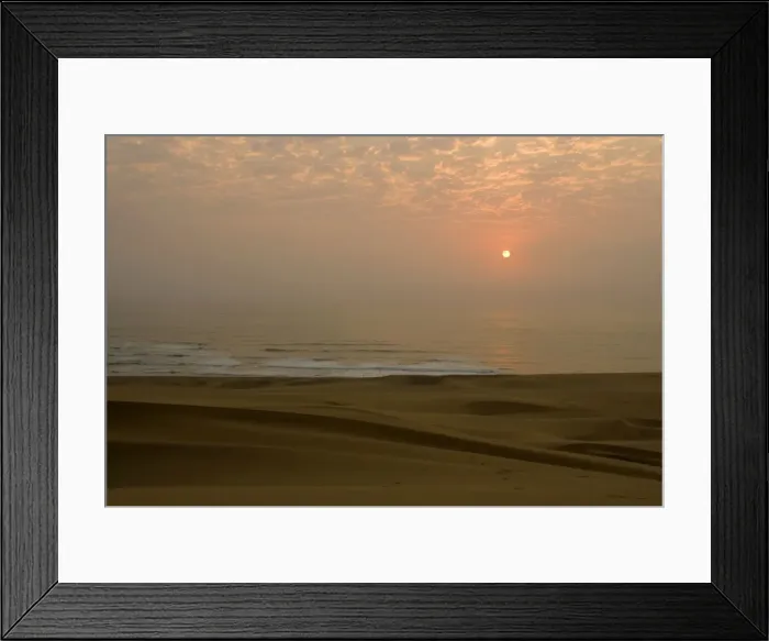 Framed Print : Sun setting over the Atlantic ocean - with dunes in the foreground - Dune Fields - Namib Desert - Namibia - Africa Framed Print : Sun setting over the Atlantic ocean - with dunes in the foreground - Dune Fields - Namib Desert - Namibia - Africa