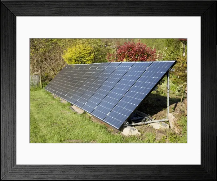 Framed Print : Array of solar PV photovolataic panels mounted on steel frame in field - Cotswolds UK Framed Print : Array of solar PV photovolataic panels mounted on steel frame in field - Cotswolds UK