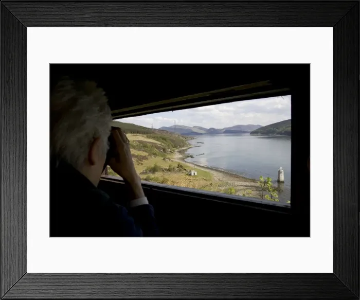 Framed Print : Person watching with binoculars in otter hide Kylerhea, Isle of Skye, Scotland Framed Print : Person watching with binoculars in otter hide Kylerhea, Isle of Skye, Scotland