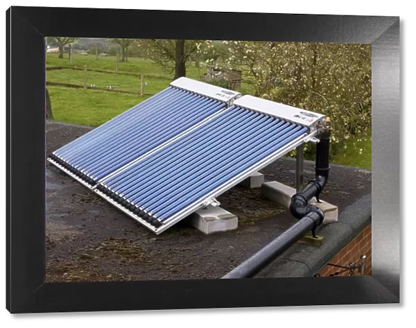 Solar thermal installation Bauer OPC 15 evacuated tubes on roof Bewdley UK